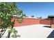 Low maintenance backyard with white rock ground cover and brick privacy wall at 404 Vassar Ln, Las Vegas, NV 89107