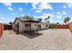 A spacious low maintenance backyard with a covered patio and desert landscaping at 404 Vassar Ln, Las Vegas, NV 89107