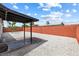 A low maintenance backyard with a covered patio and desert landscaping at 404 Vassar Ln, Las Vegas, NV 89107