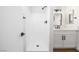 Updated bathroom featuring a walk-in shower, new fixtures, and a bright vanity at 404 Vassar Ln, Las Vegas, NV 89107