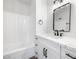 Bathroom featuring a modern vanity with drawers, sleek black fixtures, and a bathtub at 404 Vassar Ln, Las Vegas, NV 89107
