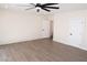 Spacious bedroom features a ceiling fan, fresh paint and wood-look vinyl flooring at 404 Vassar Ln, Las Vegas, NV 89107