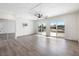 Large bedroom with new flooring, a ceiling fan, and sliding glass doors to the backyard at 404 Vassar Ln, Las Vegas, NV 89107