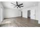 Expansive bedroom featuring new flooring, ample lighting, and direct access to the kitchen at 404 Vassar Ln, Las Vegas, NV 89107