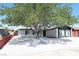 Charming single-story home with xeriscaping and mature shade tree at 404 Vassar Ln, Las Vegas, NV 89107