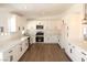 Beautiful kitchen featuring modern stainless appliances, white cabinets, and quartz counters at 404 Vassar Ln, Las Vegas, NV 89107