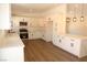 Kitchen features bright cabinetry, a breakfast bar, and stainless steel appliances at 404 Vassar Ln, Las Vegas, NV 89107