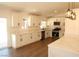 Bright updated kitchen with stainless steel appliances and waterfall quartz countertops at 404 Vassar Ln, Las Vegas, NV 89107