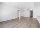 Spacious living room with light gray wood floors, recessed lighting, and neutral paint at 404 Vassar Ln, Las Vegas, NV 89107