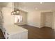 Open-concept living room and kitchen with modern lighting and spacious design at 404 Vassar Ln, Las Vegas, NV 89107