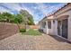 Backyard featuring synthetic grass and hardscape at 4176 Demoline Cir, Las Vegas, NV 89141