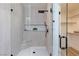 Shower showcasing glass enclosure with black hardware, plus a shelf and shower head at 4176 Demoline Cir, Las Vegas, NV 89141