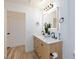 Bathroom featuring a double vanity with an illuminated mirror at 4176 Demoline Cir, Las Vegas, NV 89141