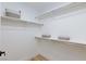 The walk-in closet offers ample storage with rod and shelf storage throughout at 4176 Demoline Cir, Las Vegas, NV 89141