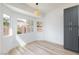 Bright dining area with modern light fixture and outside view at 4176 Demoline Cir, Las Vegas, NV 89141