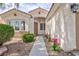 Charming single-story home featuring a well-maintained yard, stucco facade, and a welcoming front porch at 4176 Demoline Cir, Las Vegas, NV 89141