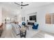 Bright and spacious living room with modern fireplace and dining area at 4176 Demoline Cir, Las Vegas, NV 89141