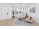 Bright living space with arched windows, comfortable seating, and modern decor elements at 4176 Demoline Cir, Las Vegas, NV 89141