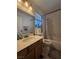 Bathroom features a single sink vanity with a shower and tub combo at 4612 Supreme Ct, Las Vegas, NV 89110