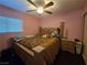 Bedroom with ceiling fan, wood floors, and natural light from the window at 4612 Supreme Ct, Las Vegas, NV 89110