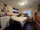 Cozy bedroom featuring wood floors, El Salvador flag, and large wooden dresser at 4612 Supreme Ct, Las Vegas, NV 89110