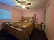Bedroom with ceiling fan, wood floors, and natural light from the window at 4612 Supreme Ct, Las Vegas, NV 89110