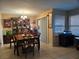 Inviting dining room with tile flooring, natural light, and stylish furnishings for Gathering meals and entertaining at 4612 Supreme Ct, Las Vegas, NV 89110