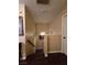 Hallway with hardwood floors that lead to an open concept layout and neutral colored walls at 4612 Supreme Ct, Las Vegas, NV 89110