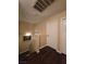 Hallway with wood floors, neutral colored walls, leading to white doors and staircase at 4612 Supreme Ct, Las Vegas, NV 89110