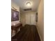 Upstairs hallway with wood flooring, neutral walls, decor, and white doors at 4612 Supreme Ct, Las Vegas, NV 89110
