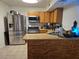 Well-equipped kitchen with stainless steel appliances, wood cabinets, and functional layout for cooking at 4612 Supreme Ct, Las Vegas, NV 89110