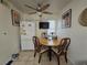 Bright eat-in kitchen with ceiling fan, small TV and natural light at 4612 Supreme Ct, Las Vegas, NV 89110