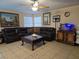 Spacious living room with tile flooring, comfortable seating, and a ceiling fan at 4612 Supreme Ct, Las Vegas, NV 89110