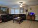 Spacious living room with tile flooring, comfortable seating, and a ceiling fan at 4612 Supreme Ct, Las Vegas, NV 89110