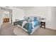 Relaxing bedroom with soft blue accents, a plush bed, and a view into the ensuite bathroom at 50 Aura De Blanco St # 2104, Henderson, NV 89074