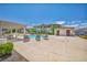 Great community pool with lounge chairs, tables, and shaded pergola at 50 Aura De Blanco St # 2104, Henderson, NV 89074