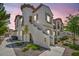 Beautiful two-story townhouse with stucco exterior, tower feature, and private entrance at 50 Aura De Blanco St # 2104, Henderson, NV 89074