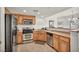 Well-equipped kitchen with stainless steel appliances, stylish wood cabinetry, and ample counter space at 50 Aura De Blanco St # 2104, Henderson, NV 89074