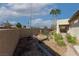 Backyard garden area with mature trees, plants, and a privacy wall provides outdoor enjoyment at 5016 Wayfaring Tree Ave, Las Vegas, NV 89131