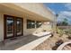 A covered patio extends from the house to the backyard, enhancing outdoor living and curb appeal at 5016 Wayfaring Tree Ave, Las Vegas, NV 89131