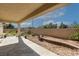 Covered patio space with stone columns overlooks the garden area, offering relaxation and outdoor enjoyment at 5016 Wayfaring Tree Ave, Las Vegas, NV 89131