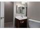 Bathroom featuring a vanity with a sink and a toilet; functional and well-lit at 5016 Wayfaring Tree Ave, Las Vegas, NV 89131