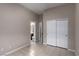 Bedroom featuring tile flooring, neutral walls, closet, and an ensuite bathroom at 5016 Wayfaring Tree Ave, Las Vegas, NV 89131