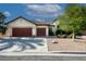 Charming single-story home featuring a three-car garage, neutral stucco, and manicured desert landscaping at 5016 Wayfaring Tree Ave, Las Vegas, NV 89131