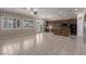 Bright kitchen with tile floors, granite counters, stainless steel appliances, and backyard access at 5016 Wayfaring Tree Ave, Las Vegas, NV 89131