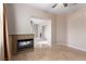 Living room featuring a fireplace, tile flooring, and an open layout to other areas of the home at 5016 Wayfaring Tree Ave, Las Vegas, NV 89131