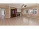 Inviting living room with tile flooring, fireplace, and large windows for natural light at 5016 Wayfaring Tree Ave, Las Vegas, NV 89131