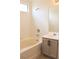 Bathroom showcasing a tub with a shower, a vanity with drawers, and a mirror at 5112 Foggia Ave, Las Vegas, NV 89130