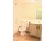 Clean, bright bathroom features a shower-tub combo, toilet and vanity with cabinet at 5112 Foggia Ave, Las Vegas, NV 89130