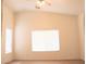 Bedroom with vaulted ceiling, ceiling fan, and large window with blinds at 5112 Foggia Ave, Las Vegas, NV 89130